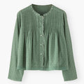 Green textured blouse on a white background